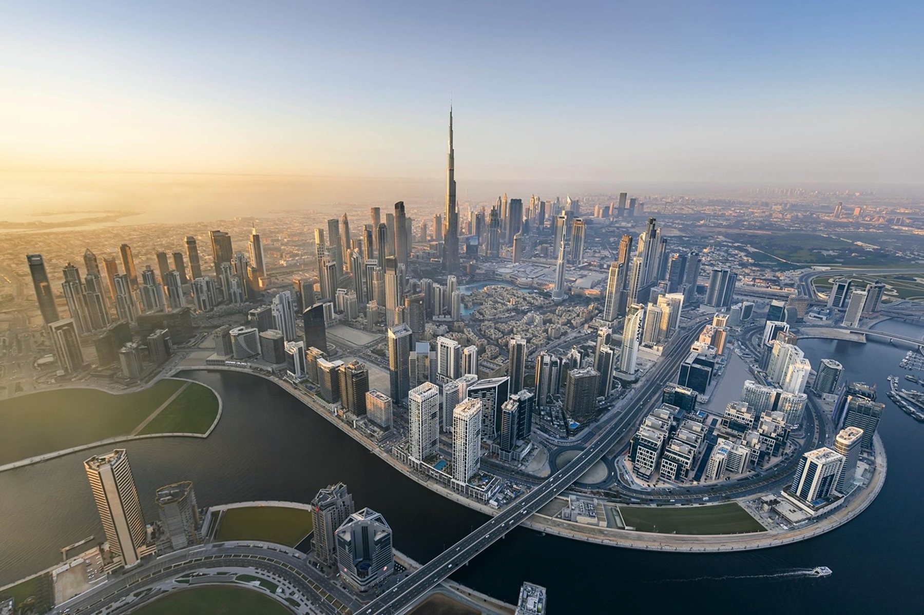 Aerial view of Downtown Dubai and Business Bay at sunrise